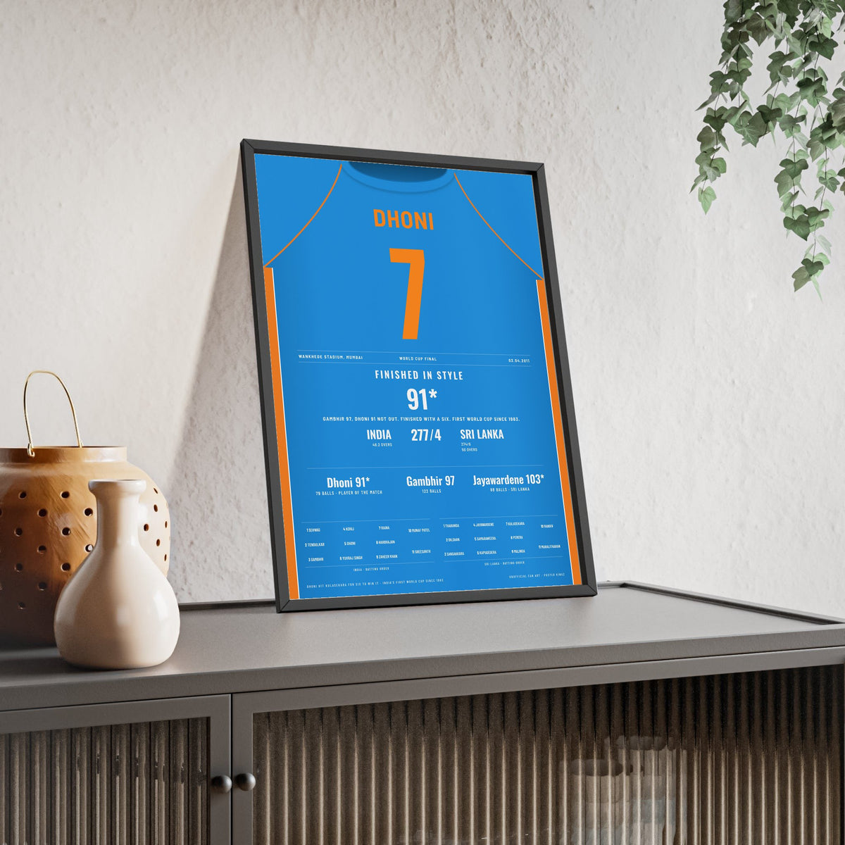 MS Dhoni Mumbai 2011 Cricket World Cup Final Poster - 91 Not Out Shirt Print framed and leaning on a sideboard