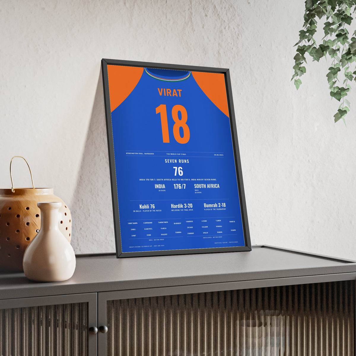 Virat Kohli Barbados 2024 T20 Final Cricket Poster - 76 Shirt Print framed and leaning on a sideboard