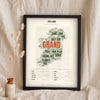 Irish Sayings Print in a black frame propped up on linen