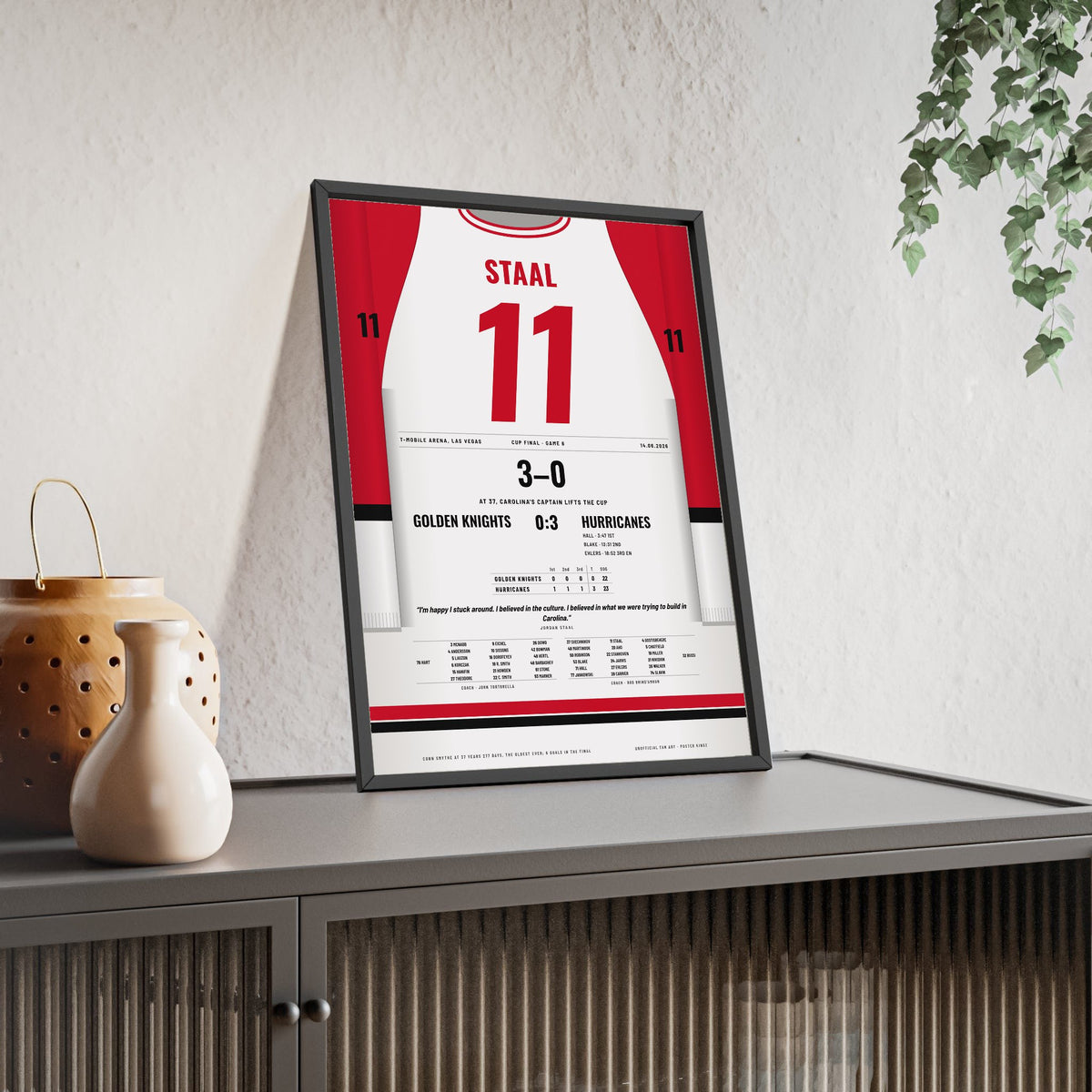 Jordan Staal 2026 Cup Final Game 6 Poster - Carolina Hurricanes 11 Hockey Jersey Print framed and leaning on a sideboard