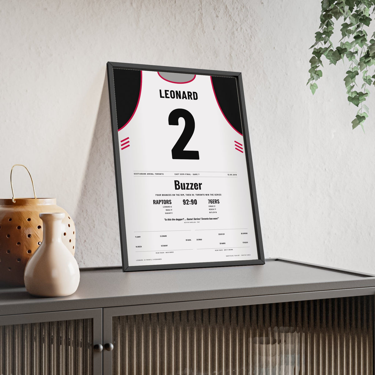 Kawhi Leonard 2019 Game 7 Buzzer-Beater Poster - Toronto Raptors 2 Four Bounces Jersey Print framed and leaning on a sideboard