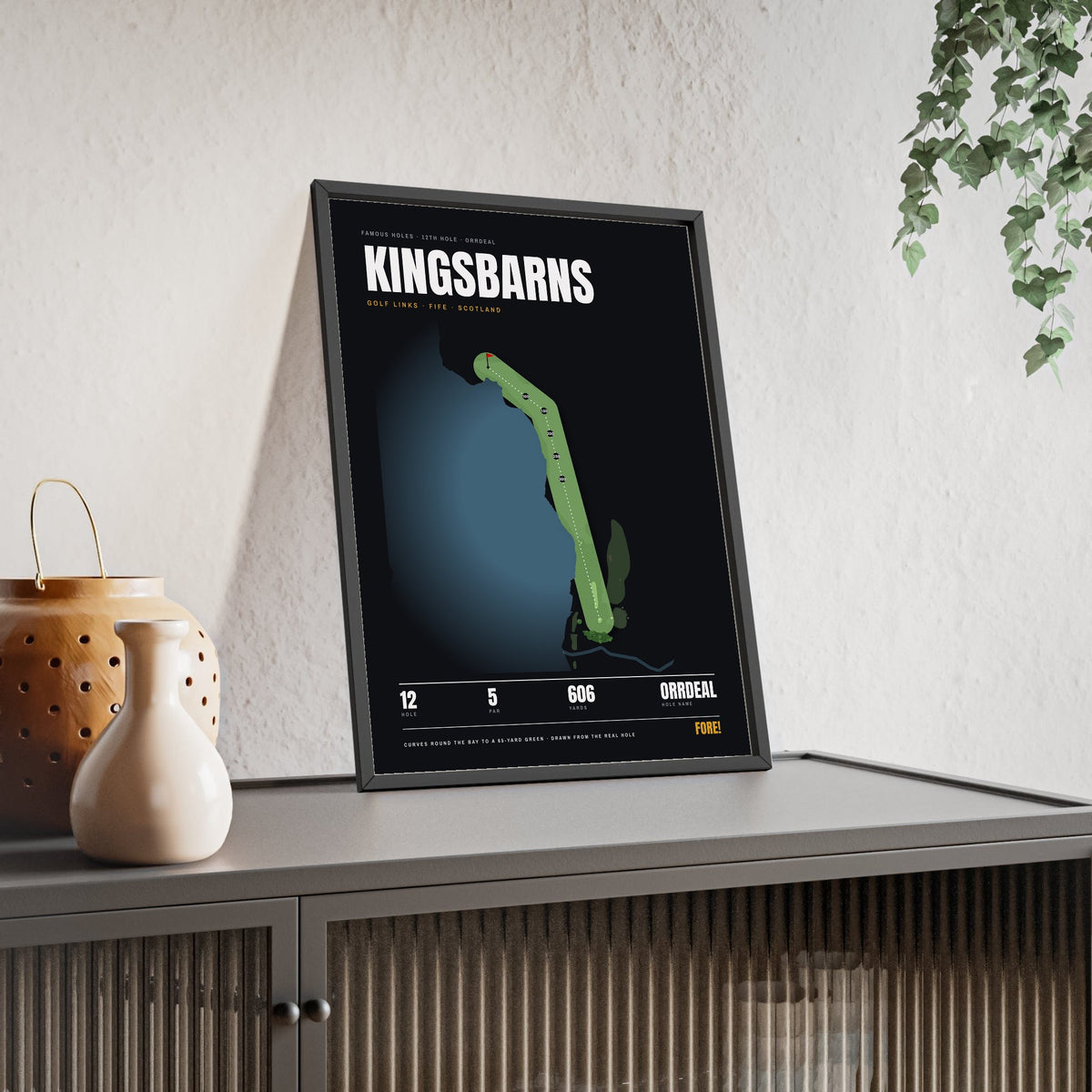 Kingsbarns 12th Hole print framed and leaning on a sideboard