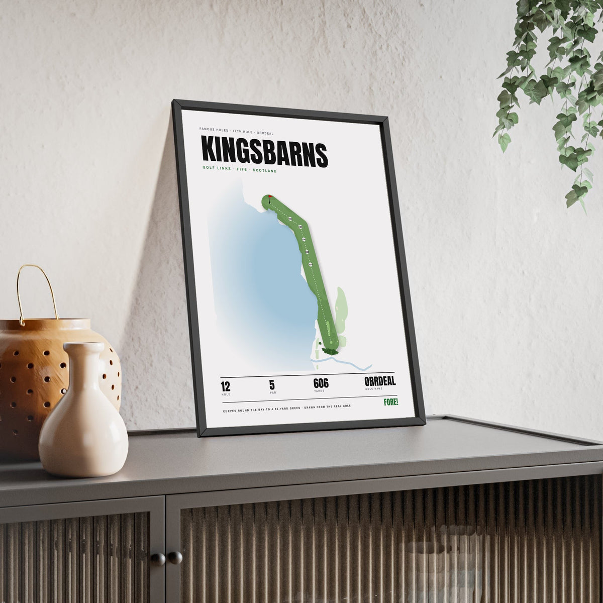 Kingsbarns 12th Hole White print framed and leaning on a sideboard