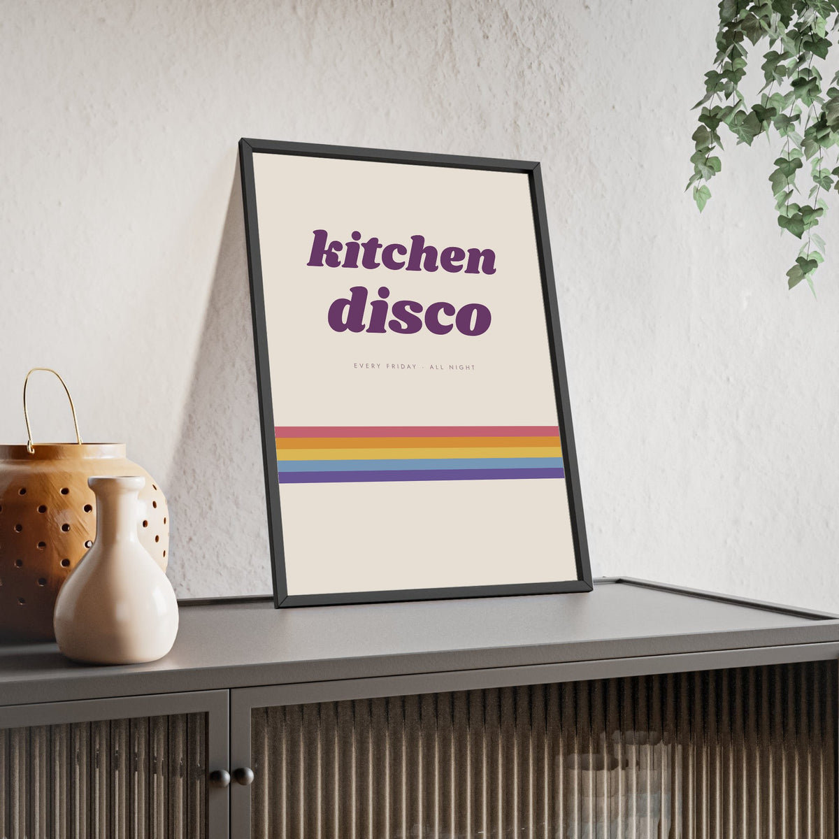 Kitchen Disco Print framed and leaning on a sideboard