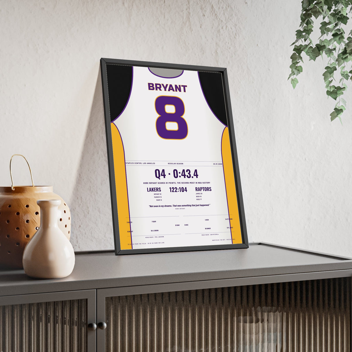 Kobe Bryant 81 Points 2006 Poster - Los Angeles Lakers 8 White Jersey Print framed and leaning on a sideboard