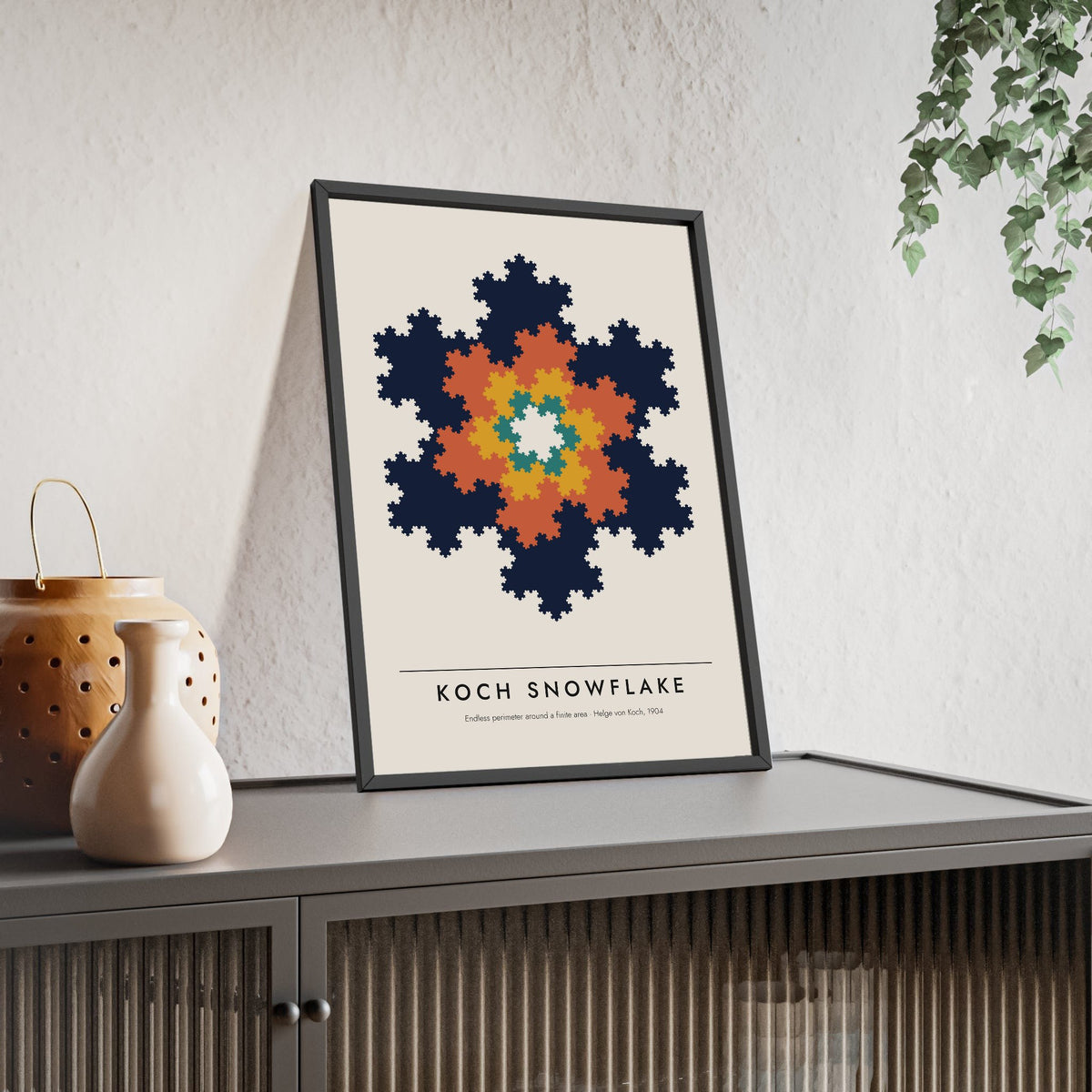 Koch Snowflake print framed and leaning on a sideboard