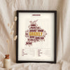 Lancashire Sayings Print in a black frame propped up on linen