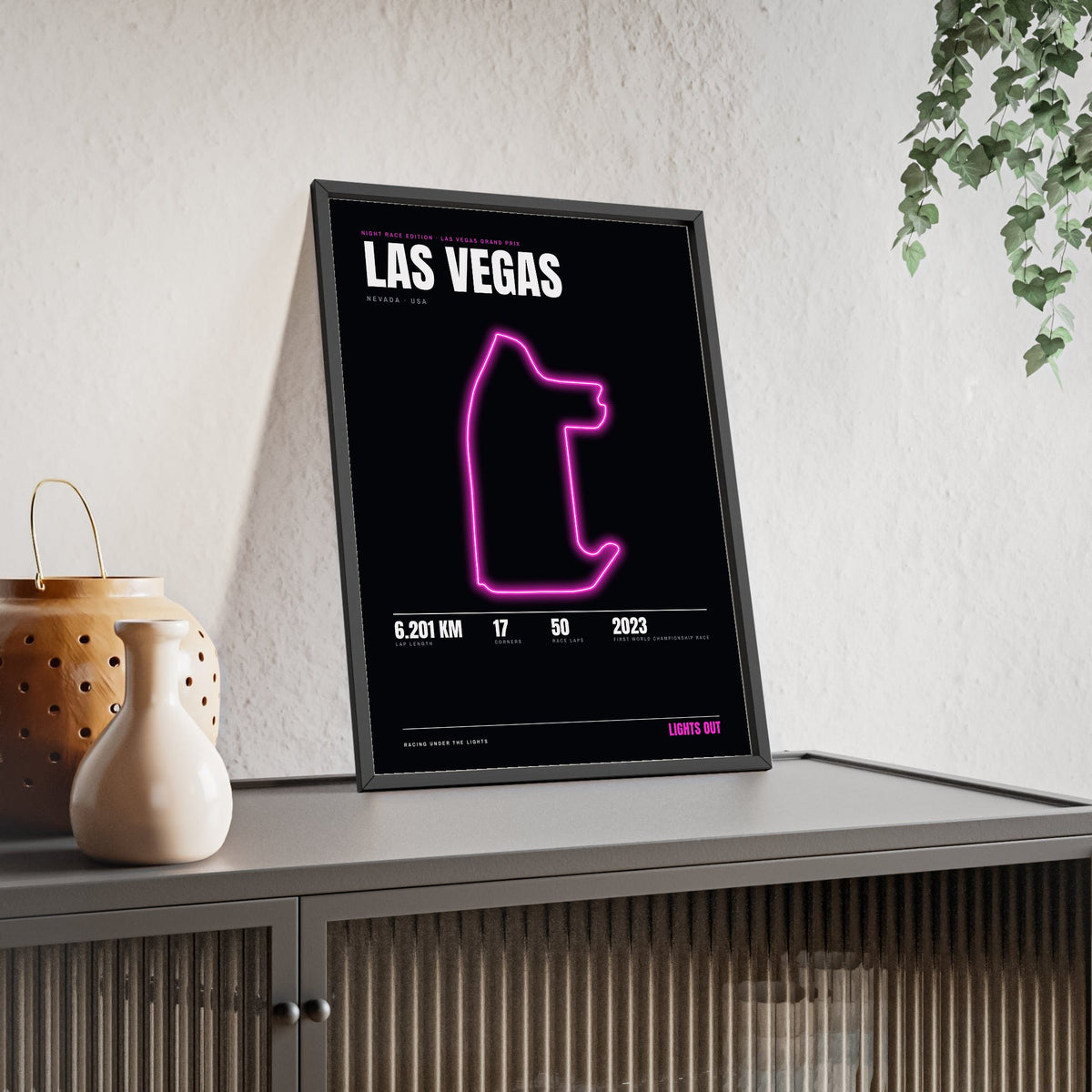 Las Vegas Night Race print framed and leaning on a sideboard