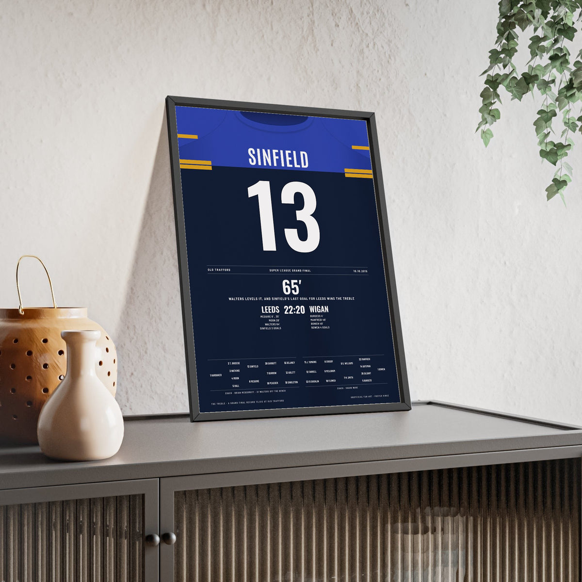 Leeds Rhinos Grand Final 2015 Poster - Kevin Sinfield 13 Treble Old Trafford Rugby League Print framed and leaning on a sideboard