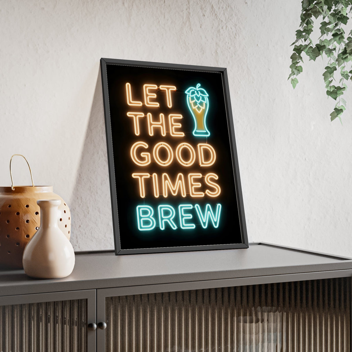 Let The Good Times Brew Neon Print framed and leaning on a sideboard
