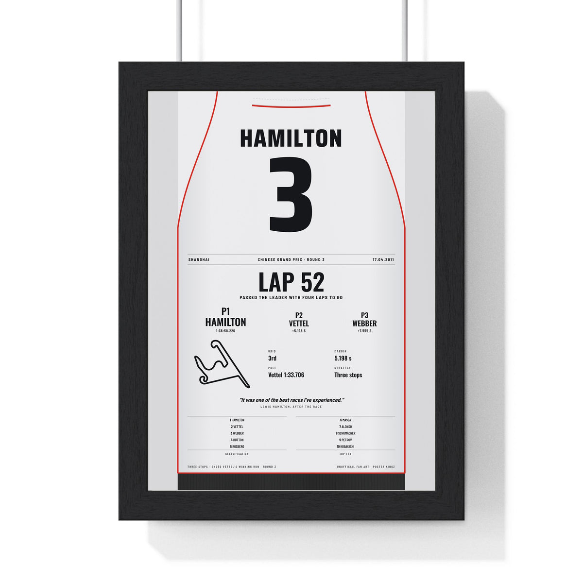 Lewis Hamilton 2011 Chinese Grand Prix Win Poster - 3 Race Suit Print framed in a black frame, ready to hang