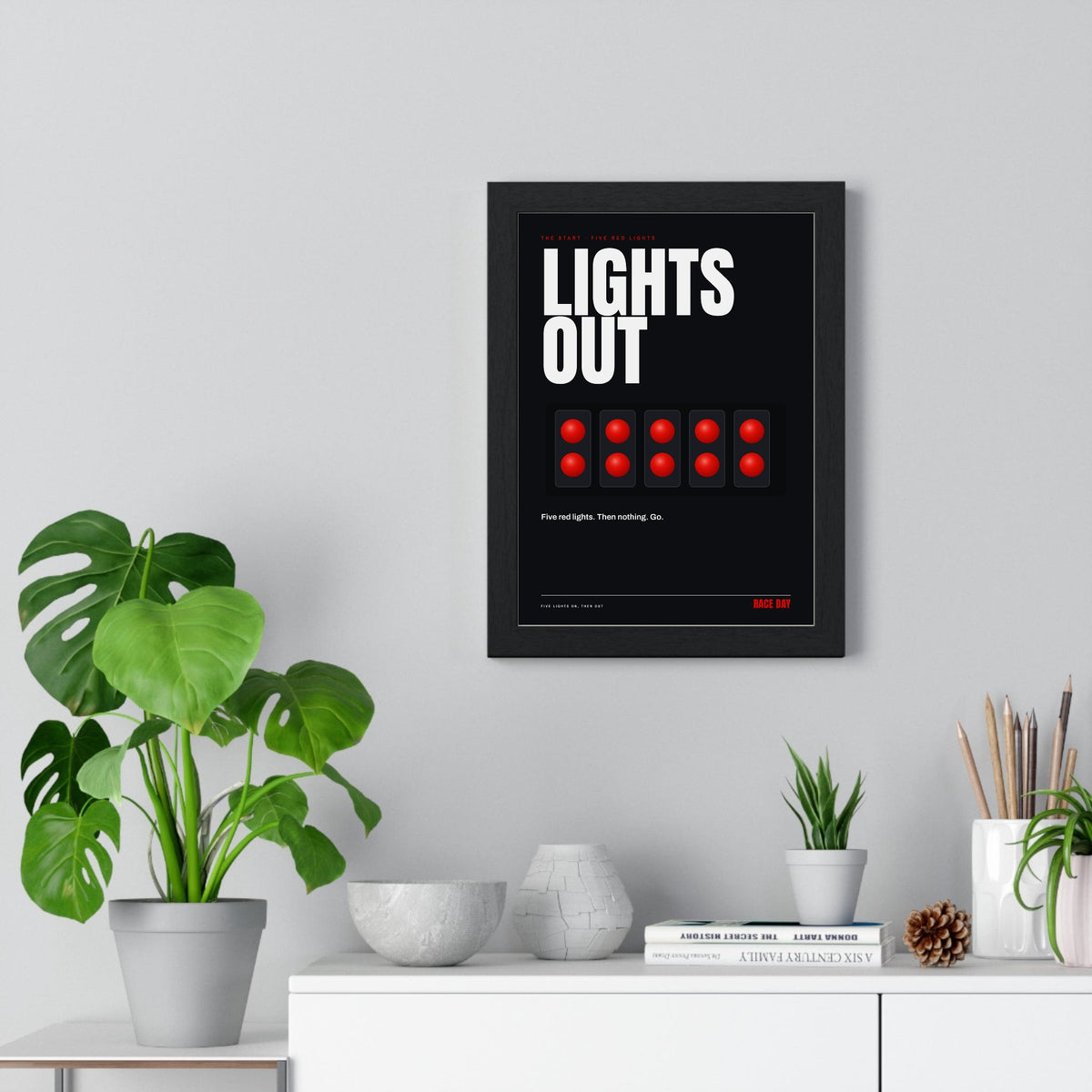 Lights Out Racing print framed on a living room wall