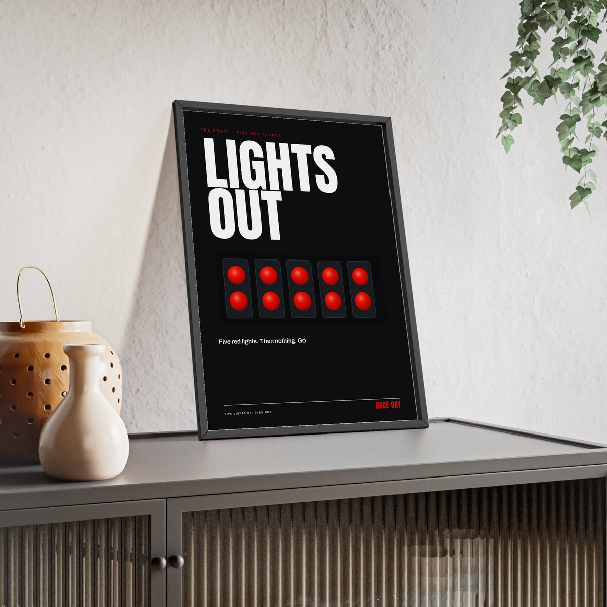 Lights Out Racing print framed and leaning on a sideboard