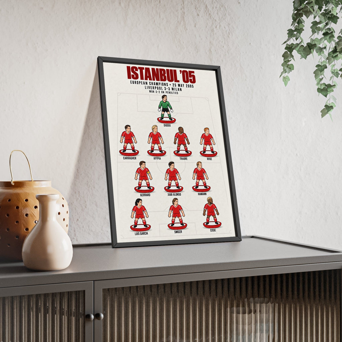 Liverpool Istanbul 2005 XI framed print leaning on a sideboard