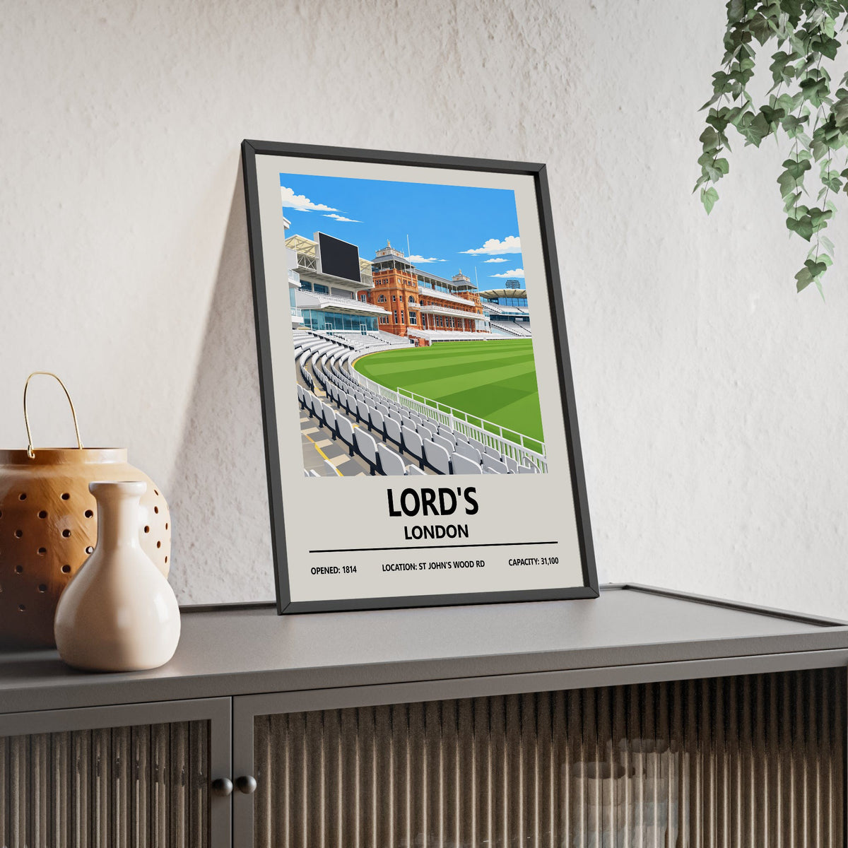 Lord's cricket ground print framed and leaning on a sideboard