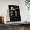 Luke Littler print framed and leaning on a sideboard