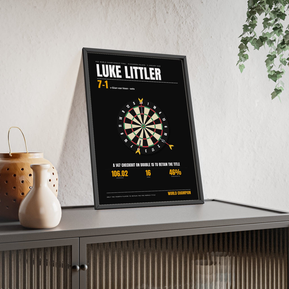 Luke Littler World Darts Champion 2026 print framed and leaning on a sideboard