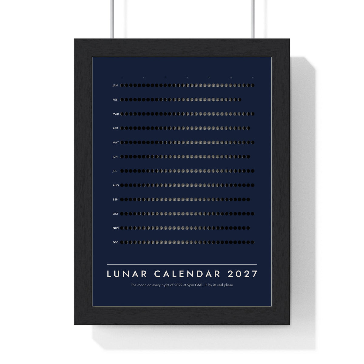 Lunar Calendar 2027 print framed in a black frame, ready to hang