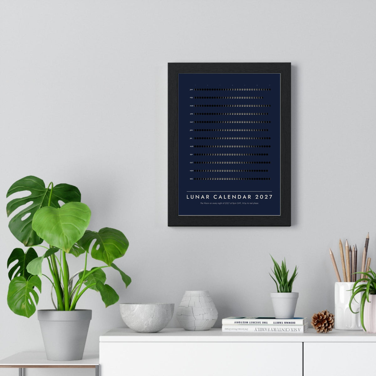 Lunar Calendar 2027 print framed on a living room wall