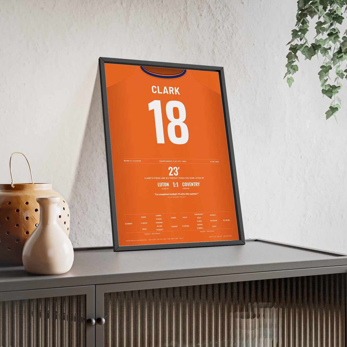 Luton Town Play-Off Final 2023 Poster - Jordan Clark 18 Wembley Shirt Print framed and leaning on a sideboard