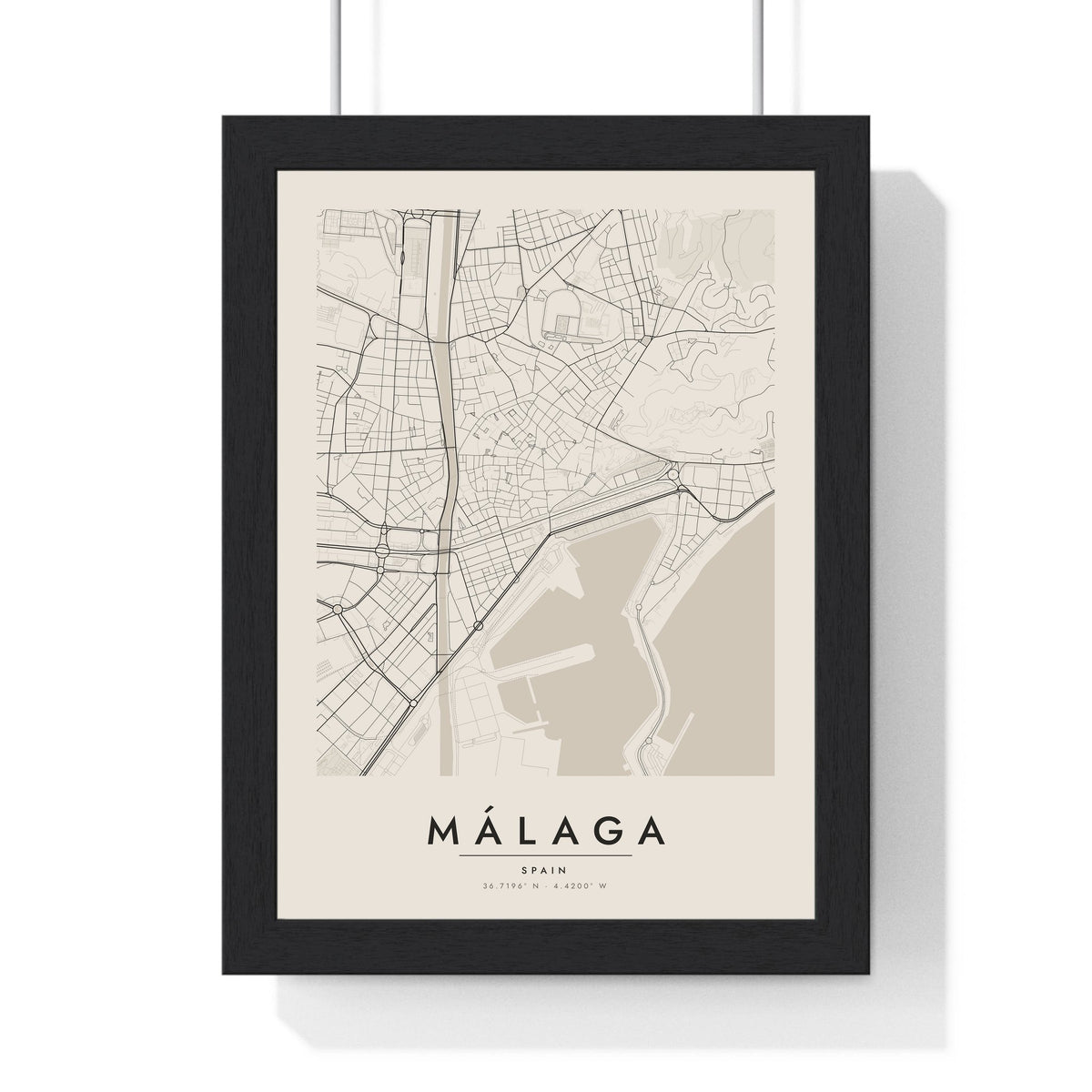 Málaga street map poster in cream, minimal city map print framed in a black frame