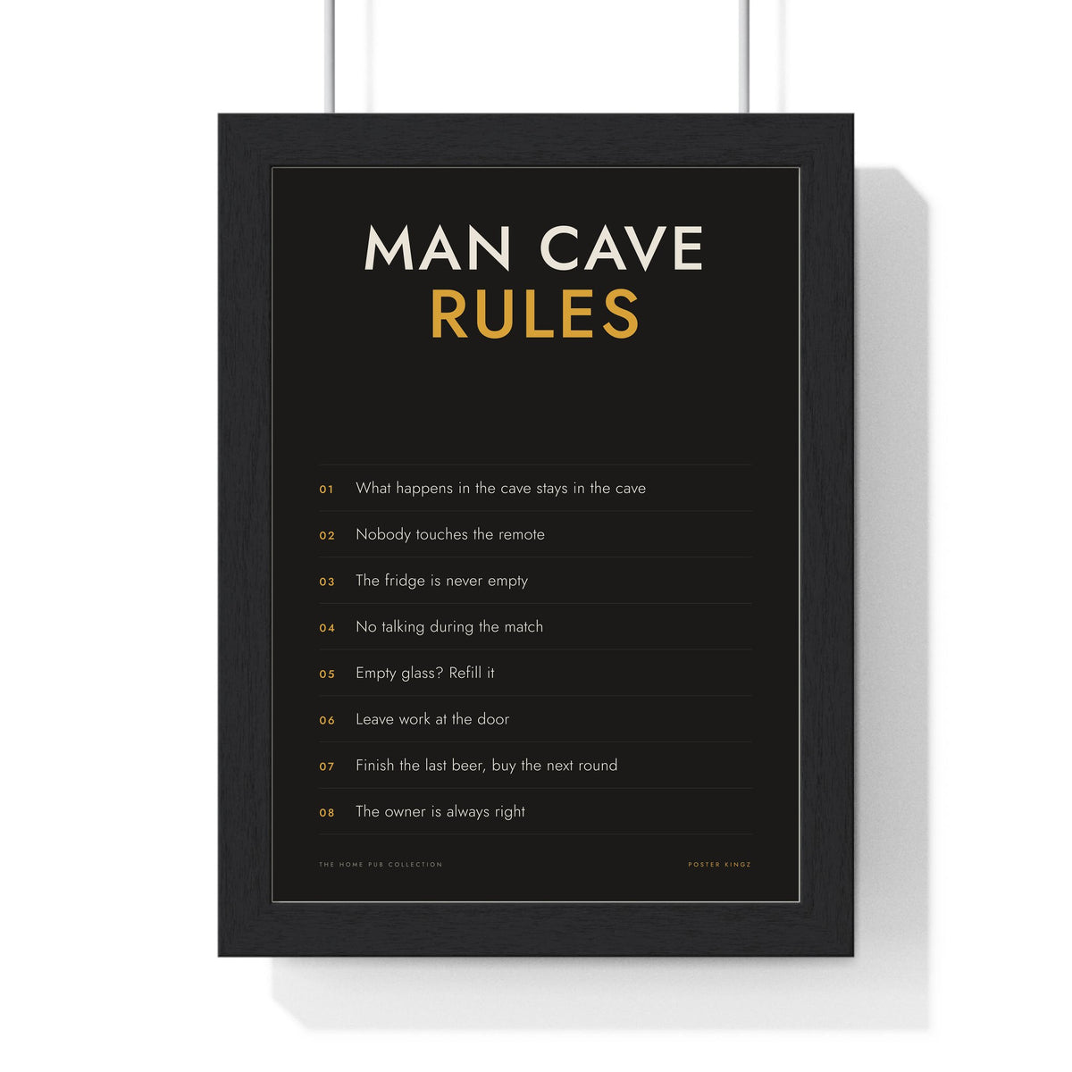 Man Cave Rules Print framed in a black frame, ready to hang