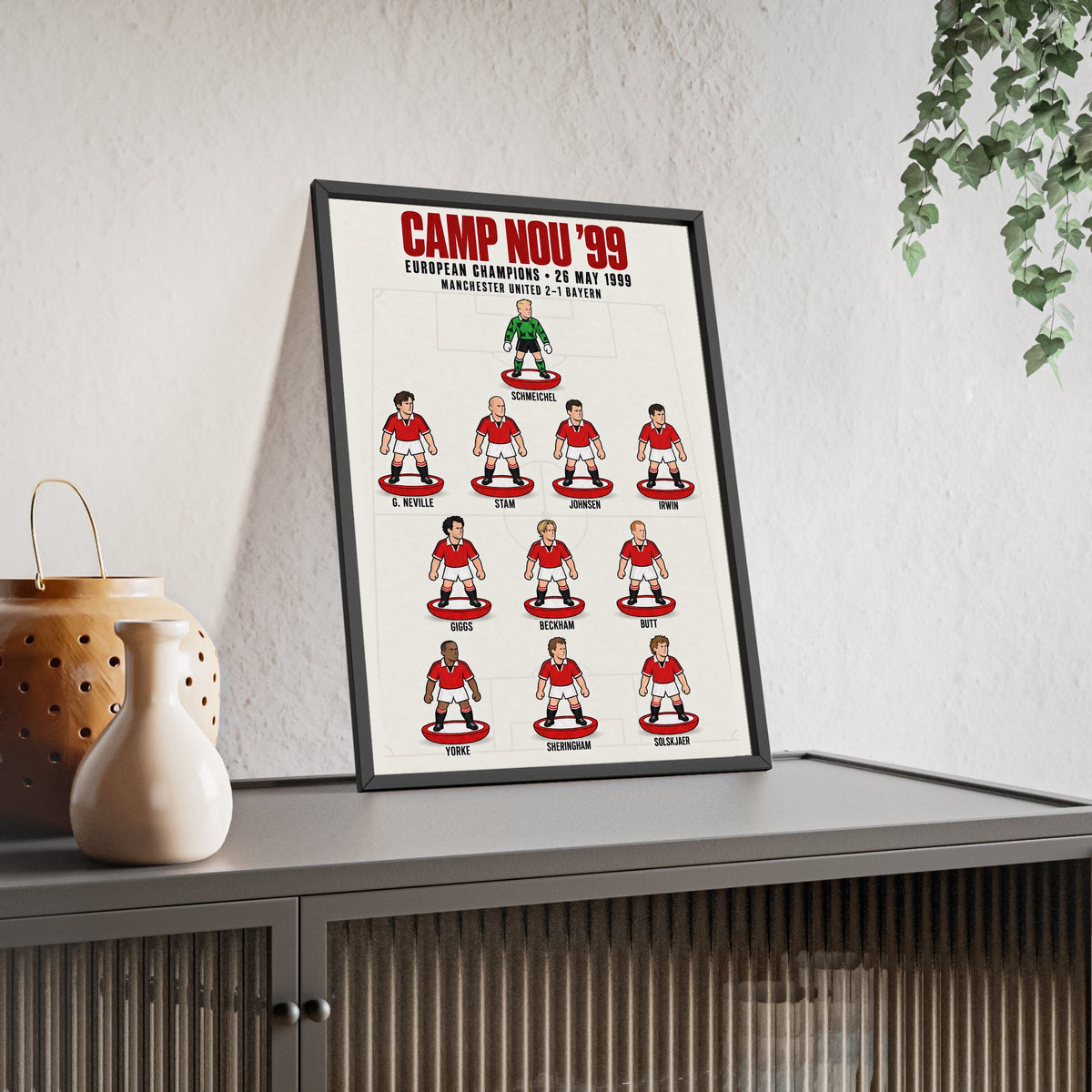 Manchester United Camp Nou 1999 XI framed print leaning on a sideboard