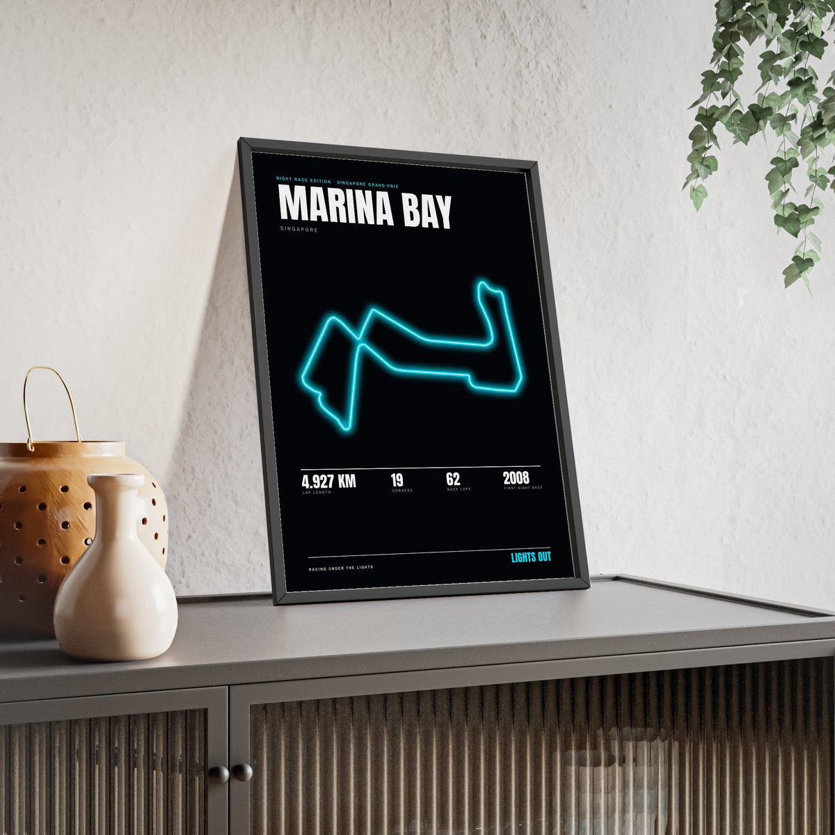 Marina Bay Night Race print framed and leaning on a sideboard