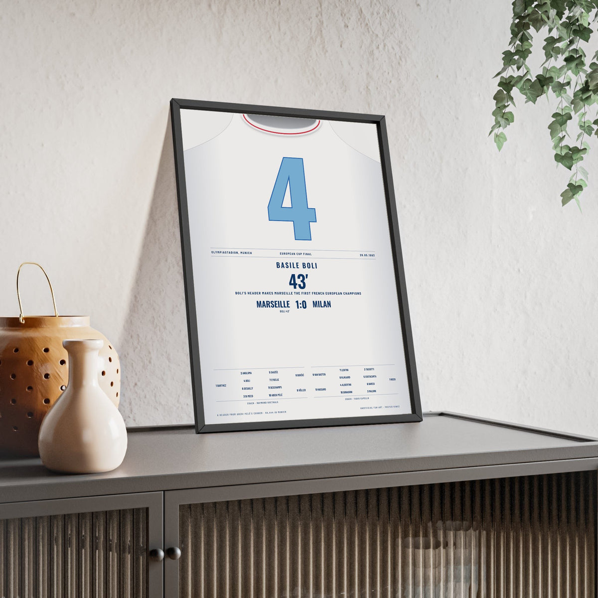 Marseille Champions League Final 1993 Poster - Basile Boli 4 Header v Milan Shirt Print framed and leaning on a sideboard