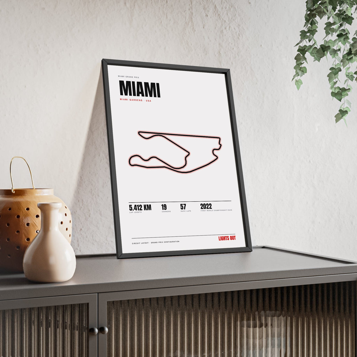 Miami Circuit print White framed and leaning on a sideboard