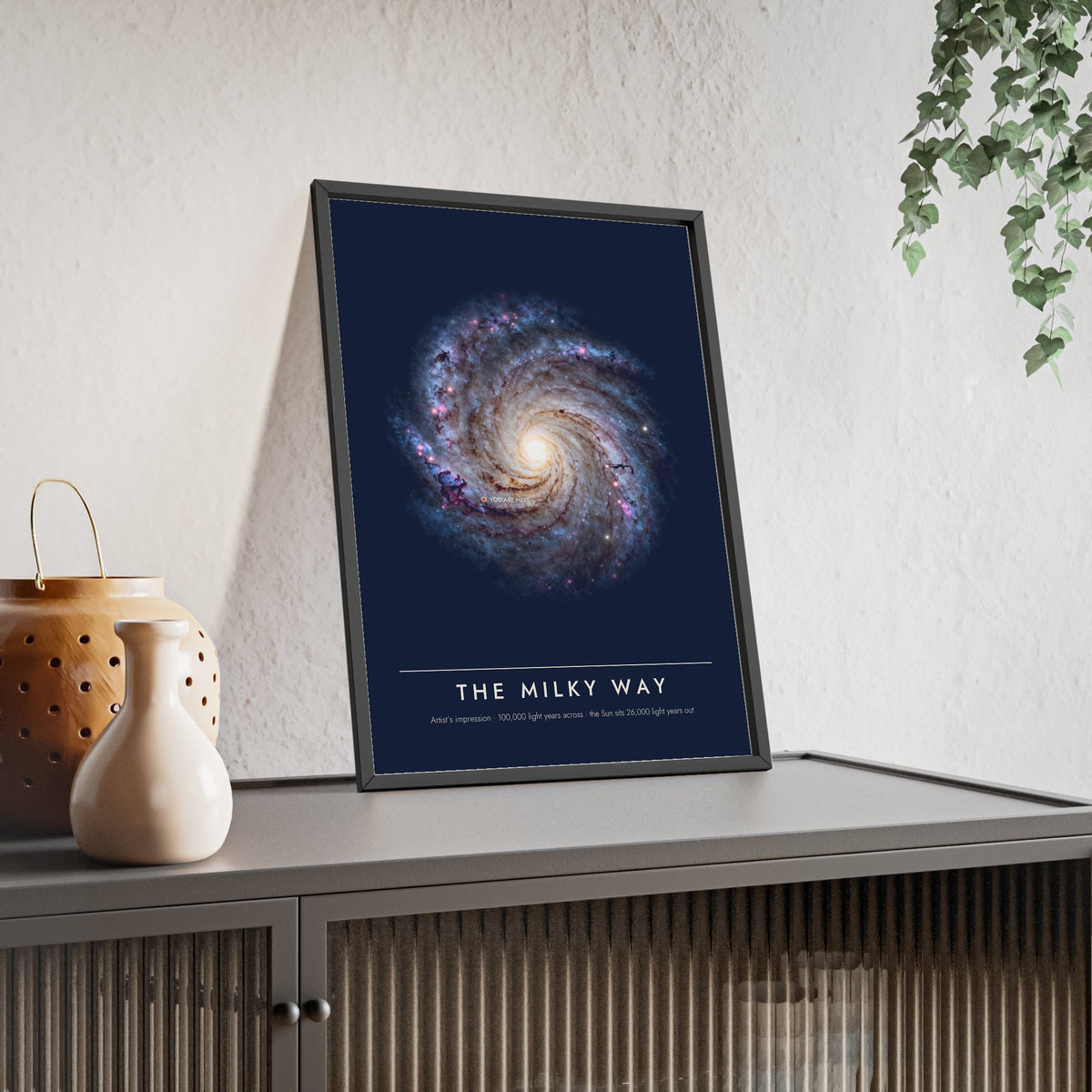 Milky Way print framed and leaning on a sideboard