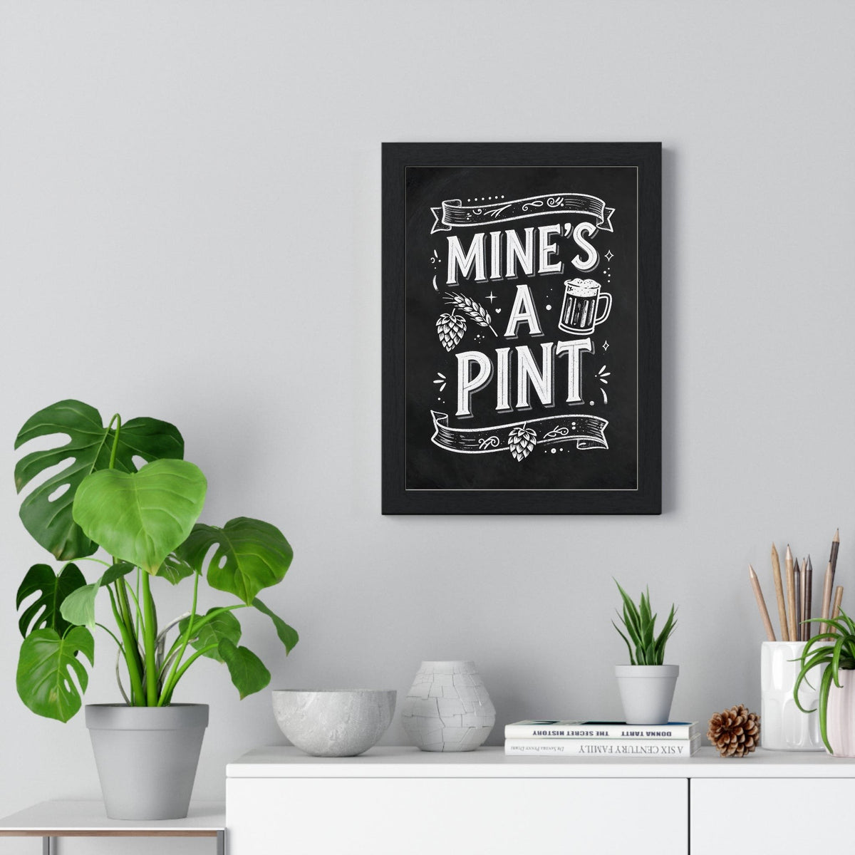 Mine's A Pint Chalkboard Print framed on a living room wall