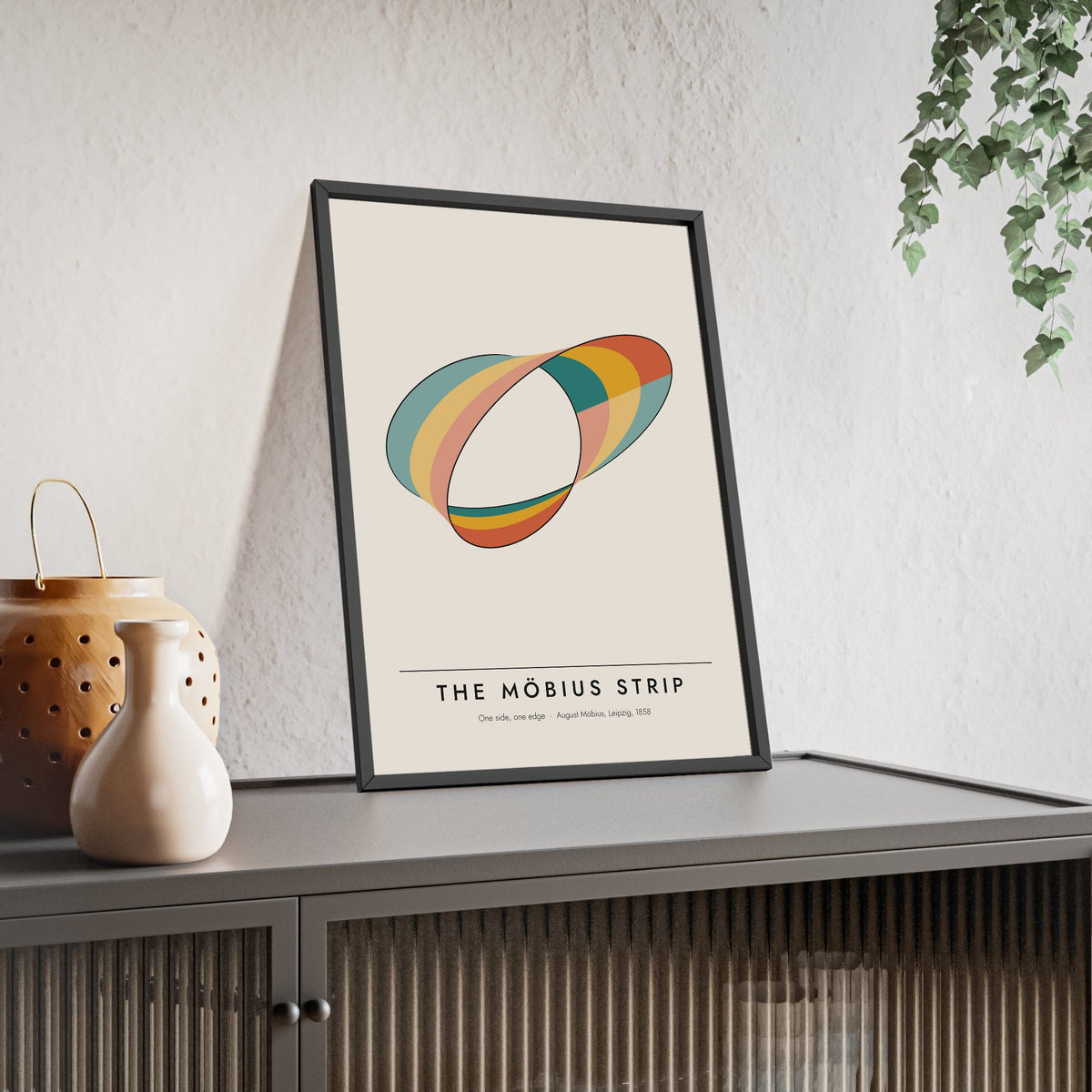 Mobius Strip print framed and leaning on a sideboard
