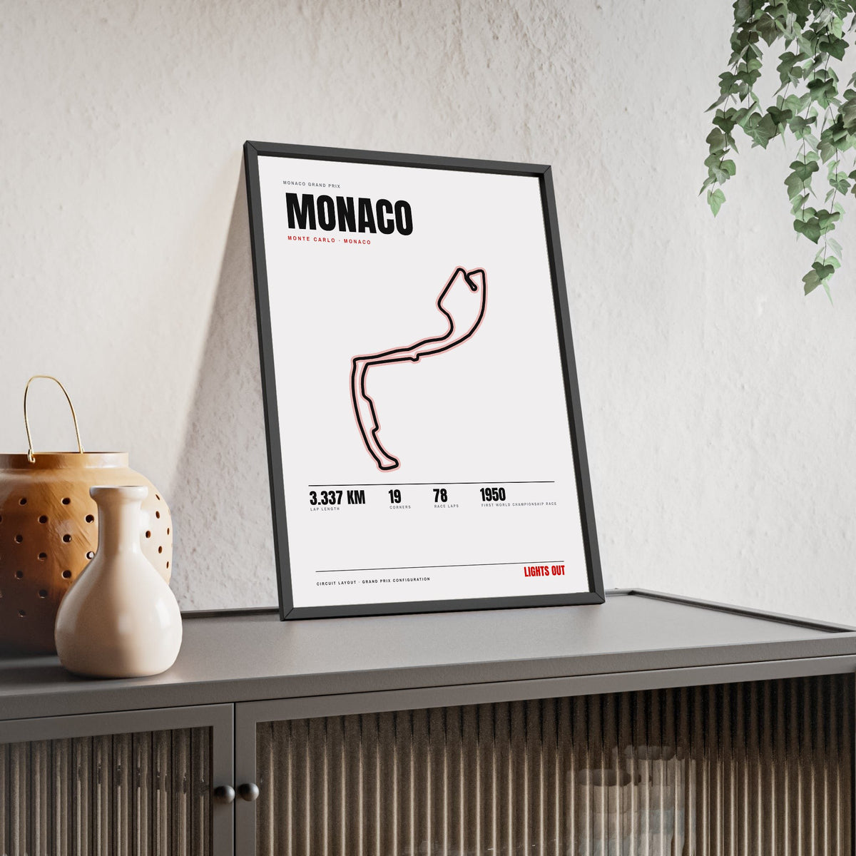 Monaco Circuit print White framed and leaning on a sideboard