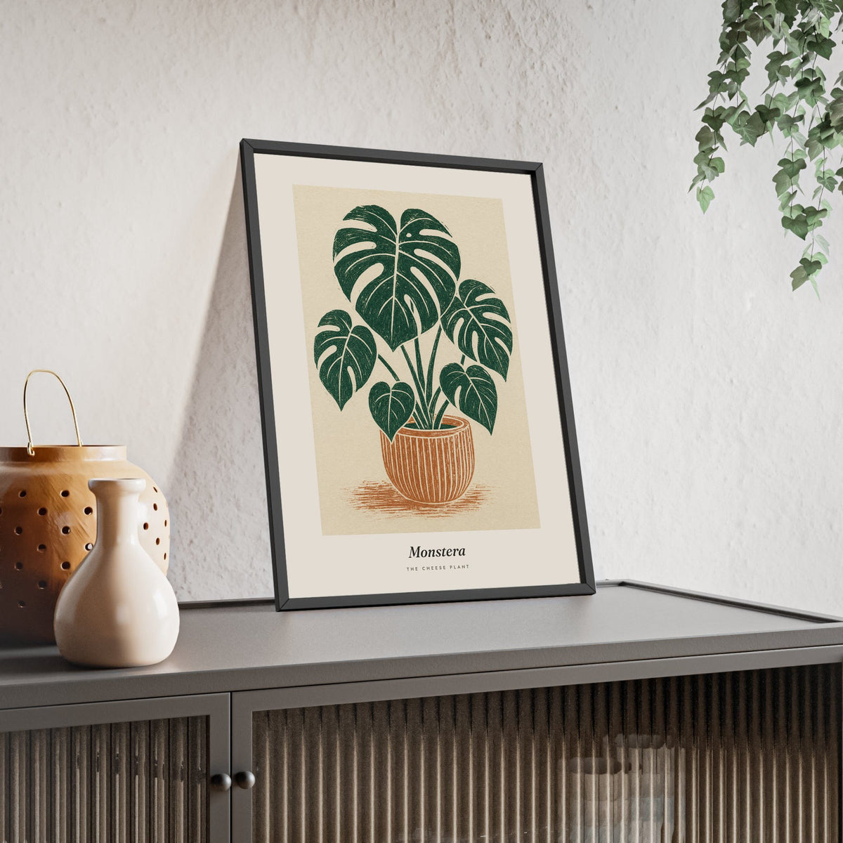 Monstera Lino Print framed and leaning on a sideboard