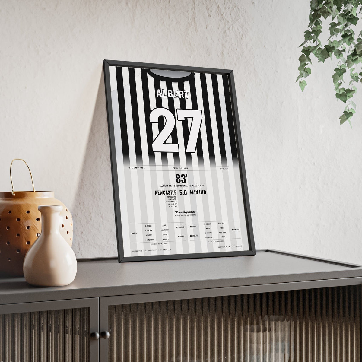 Newcastle United 5-0 Man Utd 1996 Poster - Philippe Albert 27 Chip Shirt Print framed and leaning on a sideboard