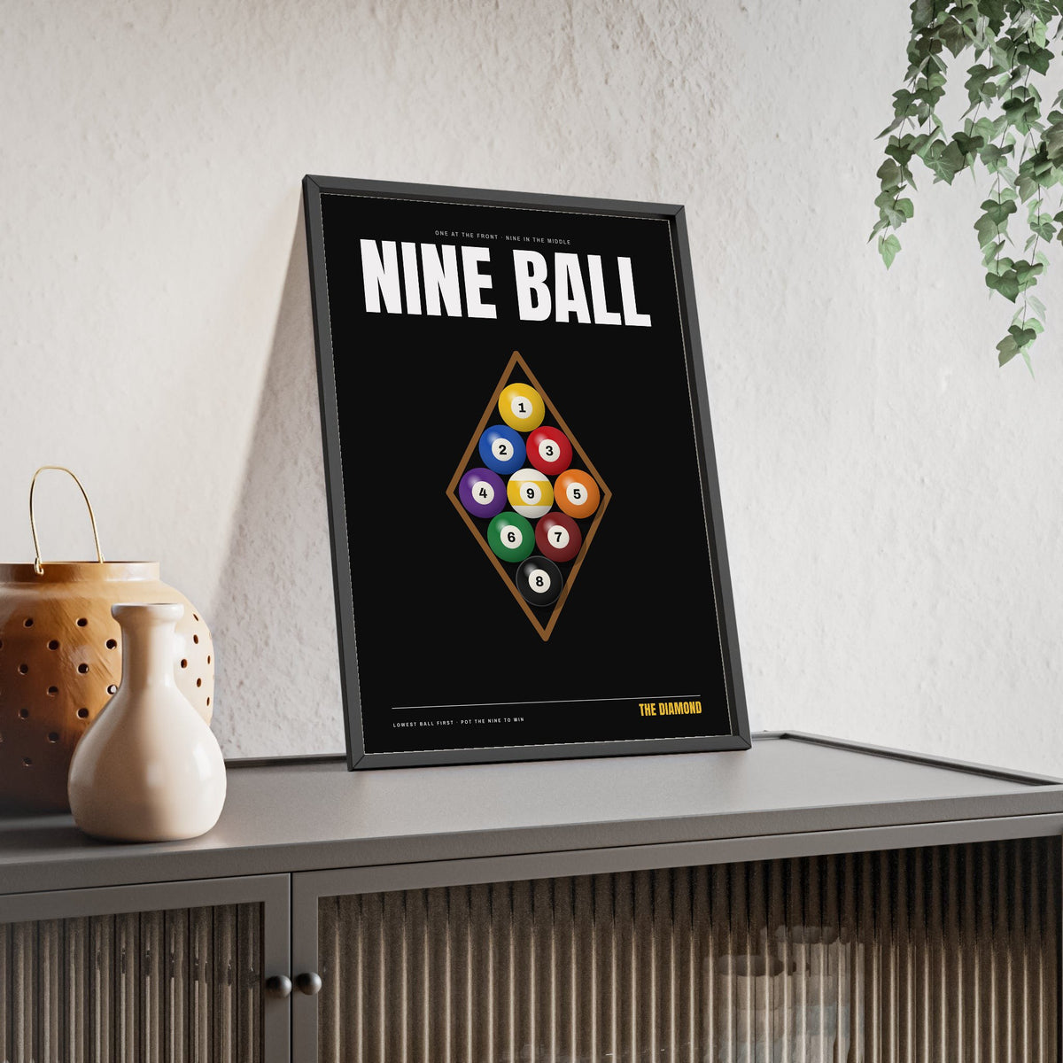 Nine Ball Pool print framed and leaning on a sideboard