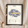Norfolk Sayings Print in a black frame propped up on linen