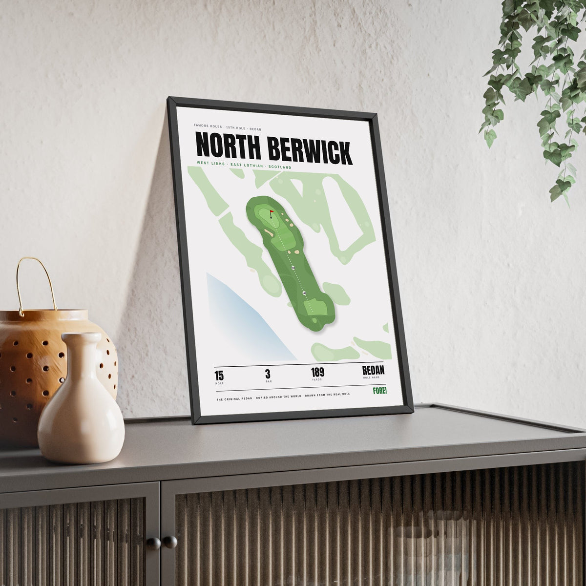 North Berwick 15th Hole White print framed and leaning on a sideboard