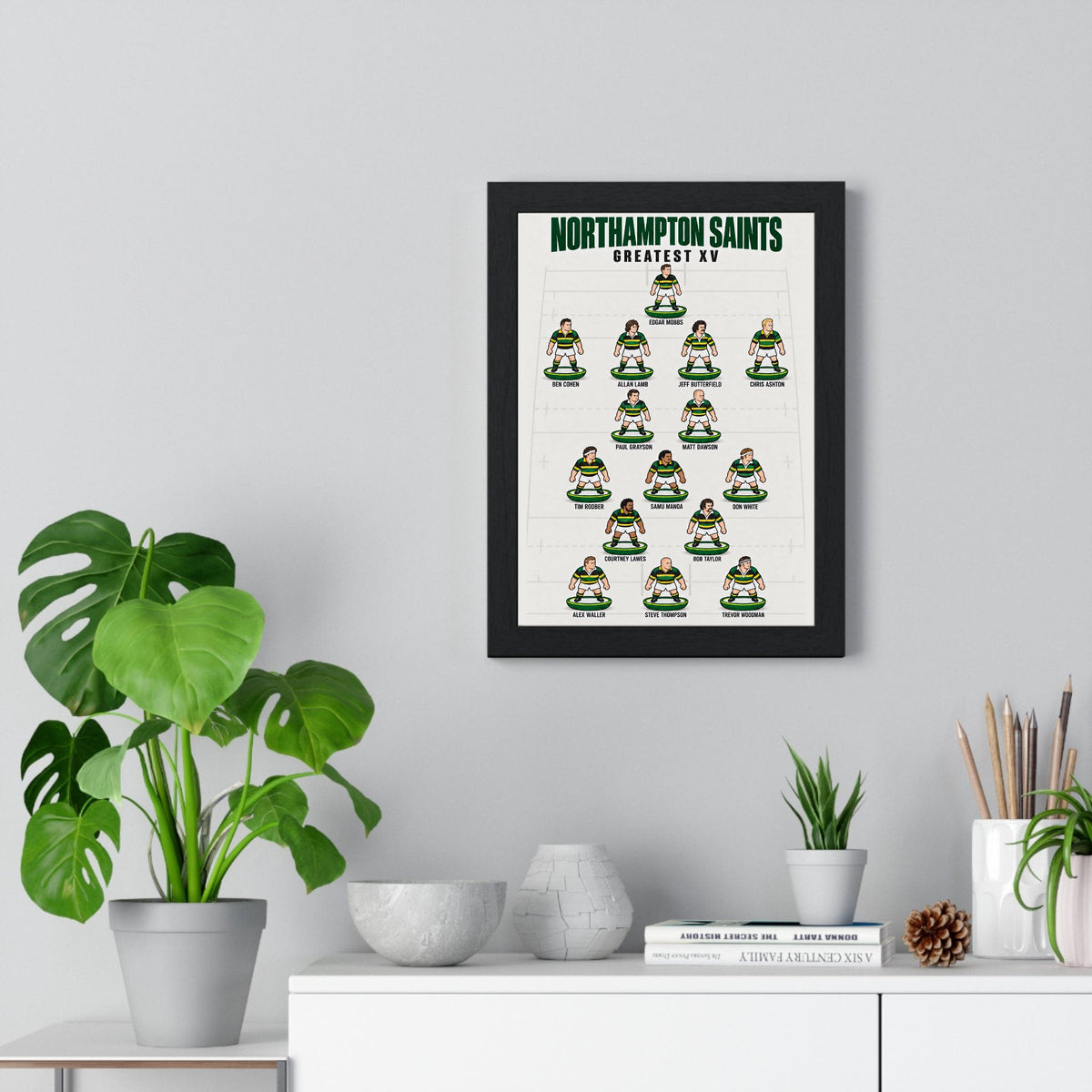 Northampton Saints Greatest XV poster framed on a living room wall