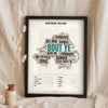 Northern Irish Sayings Print in a black frame propped up on linen
