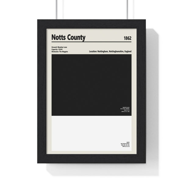 Framed Notts County colour swatch print in black and white on white wall