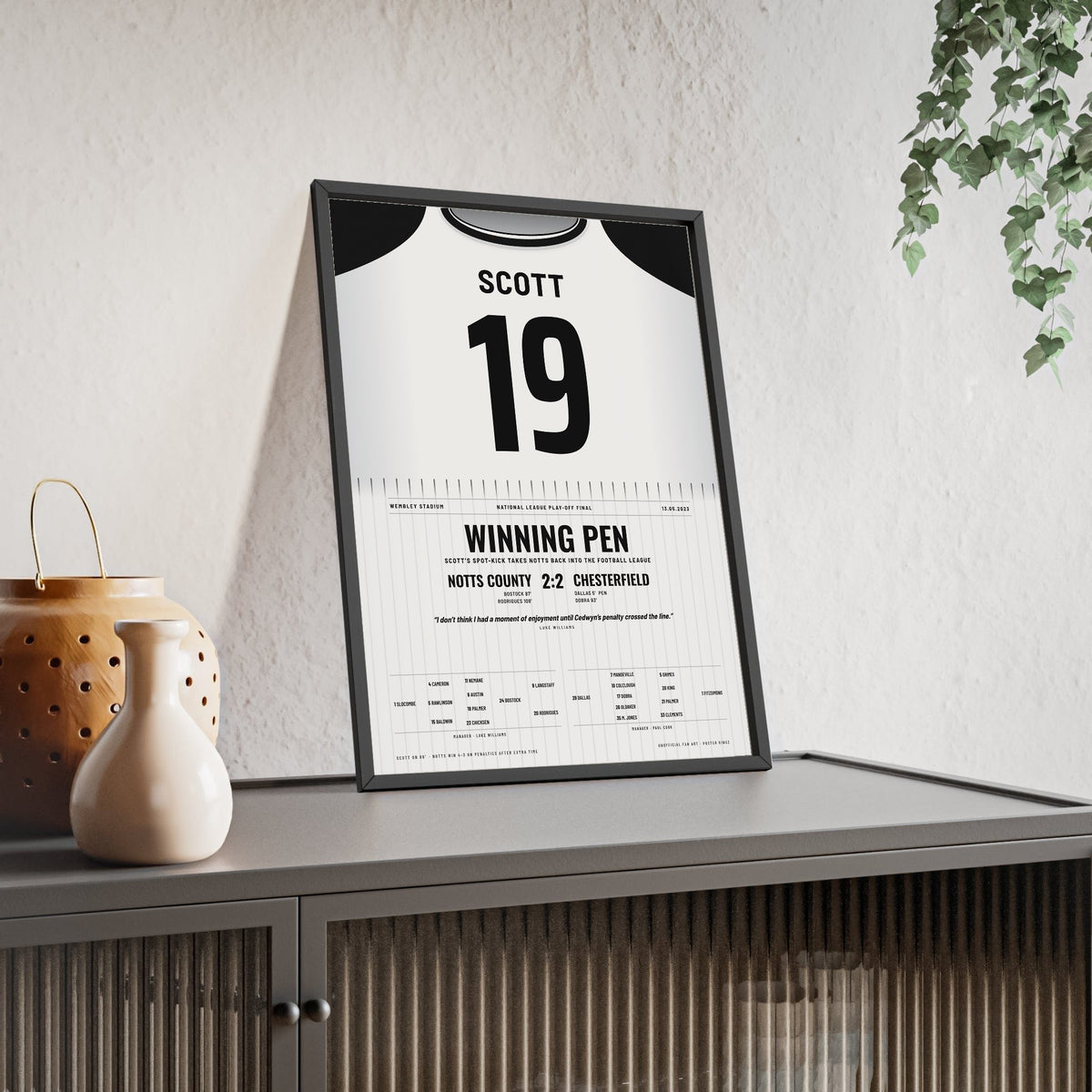 Notts County Play-Off Final 2023 Poster - Cedwyn Scott 19 Wembley Shirt Print framed and leaning on a sideboard