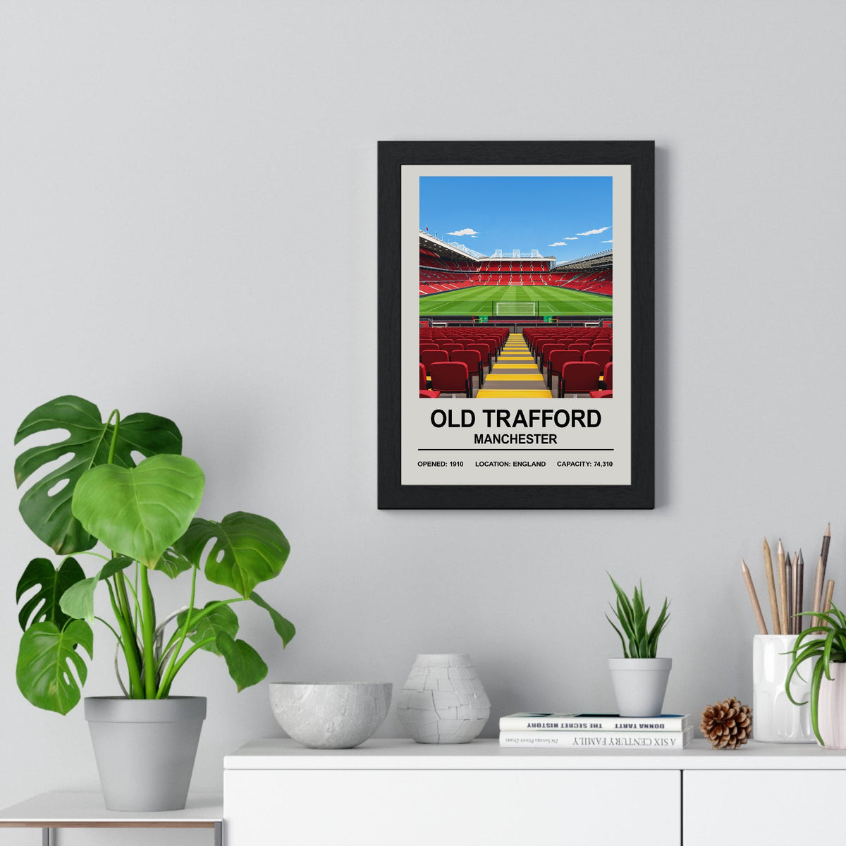 Manchester United Old Trafford print framed on a living room wall
