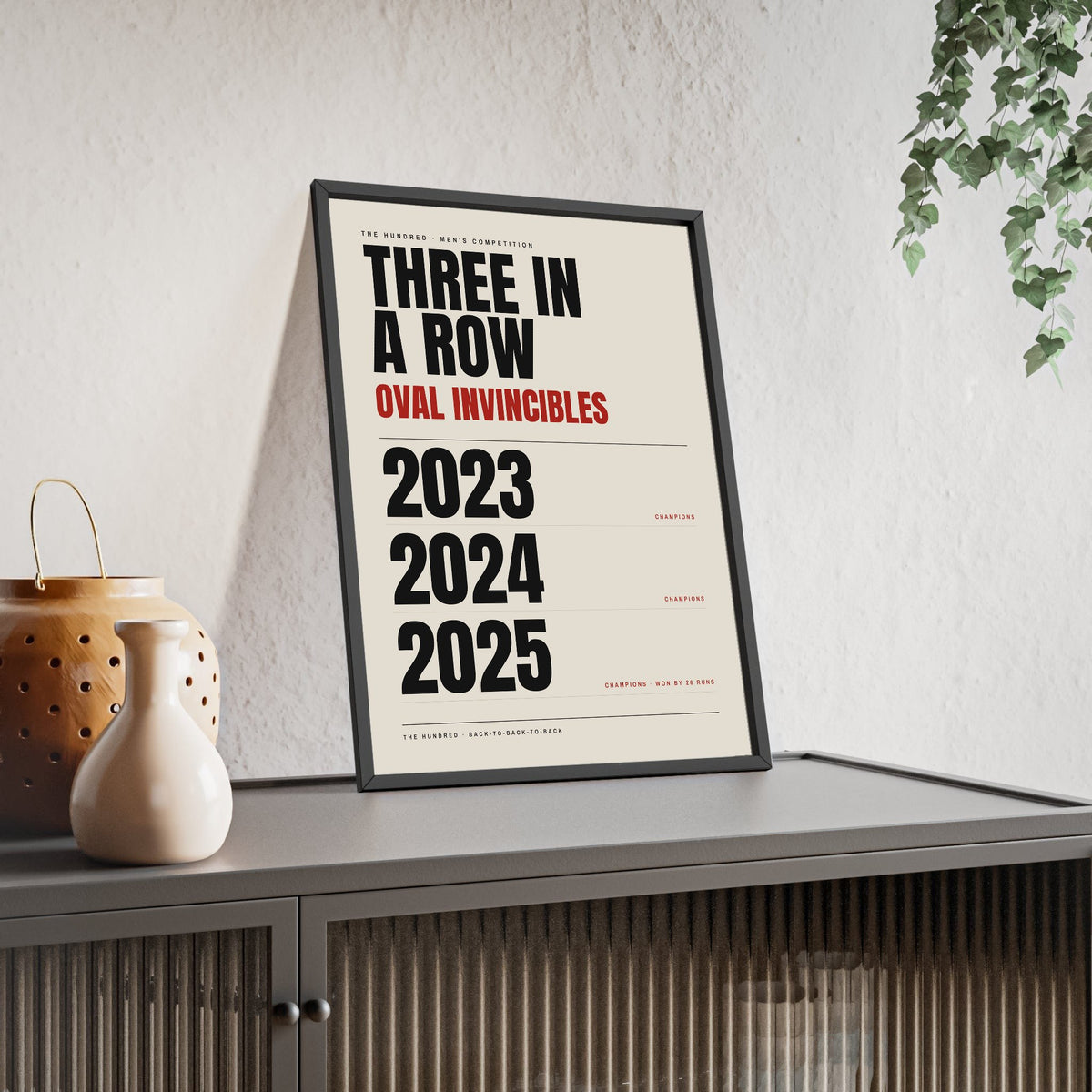 Oval Invincibles Hundred Champions 2023-2025 print framed and leaning on a sideboard