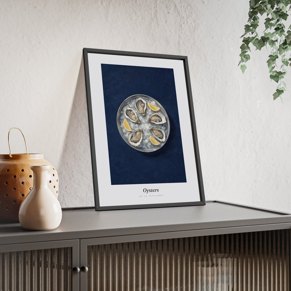 Oysters Print framed and leaning on a sideboard