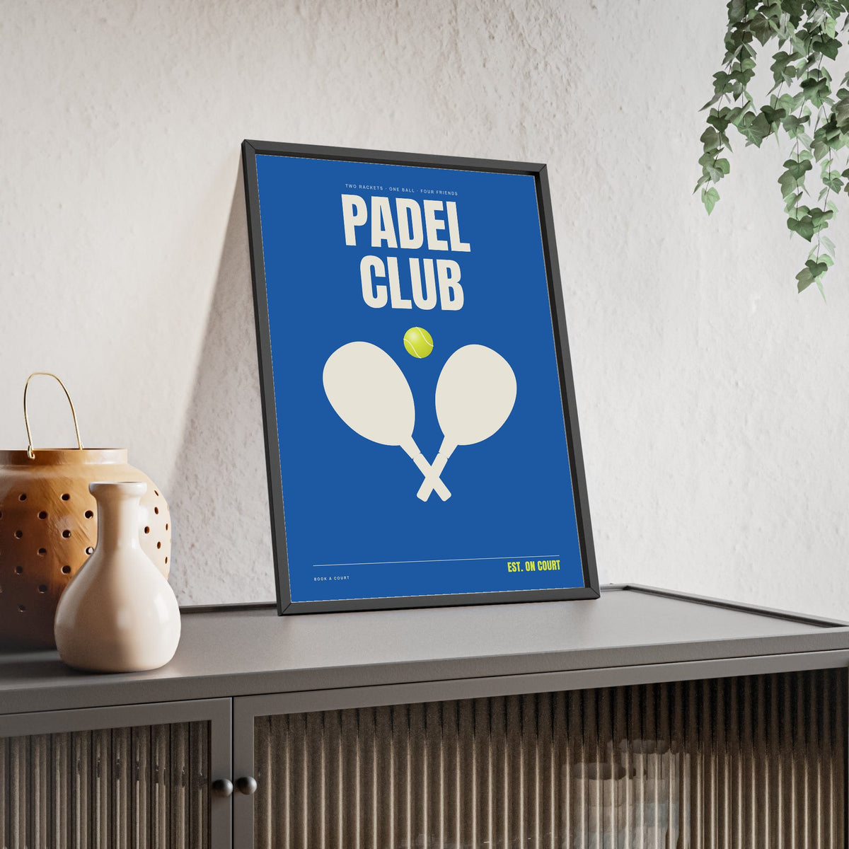 Padel Club print framed and leaning on a sideboard