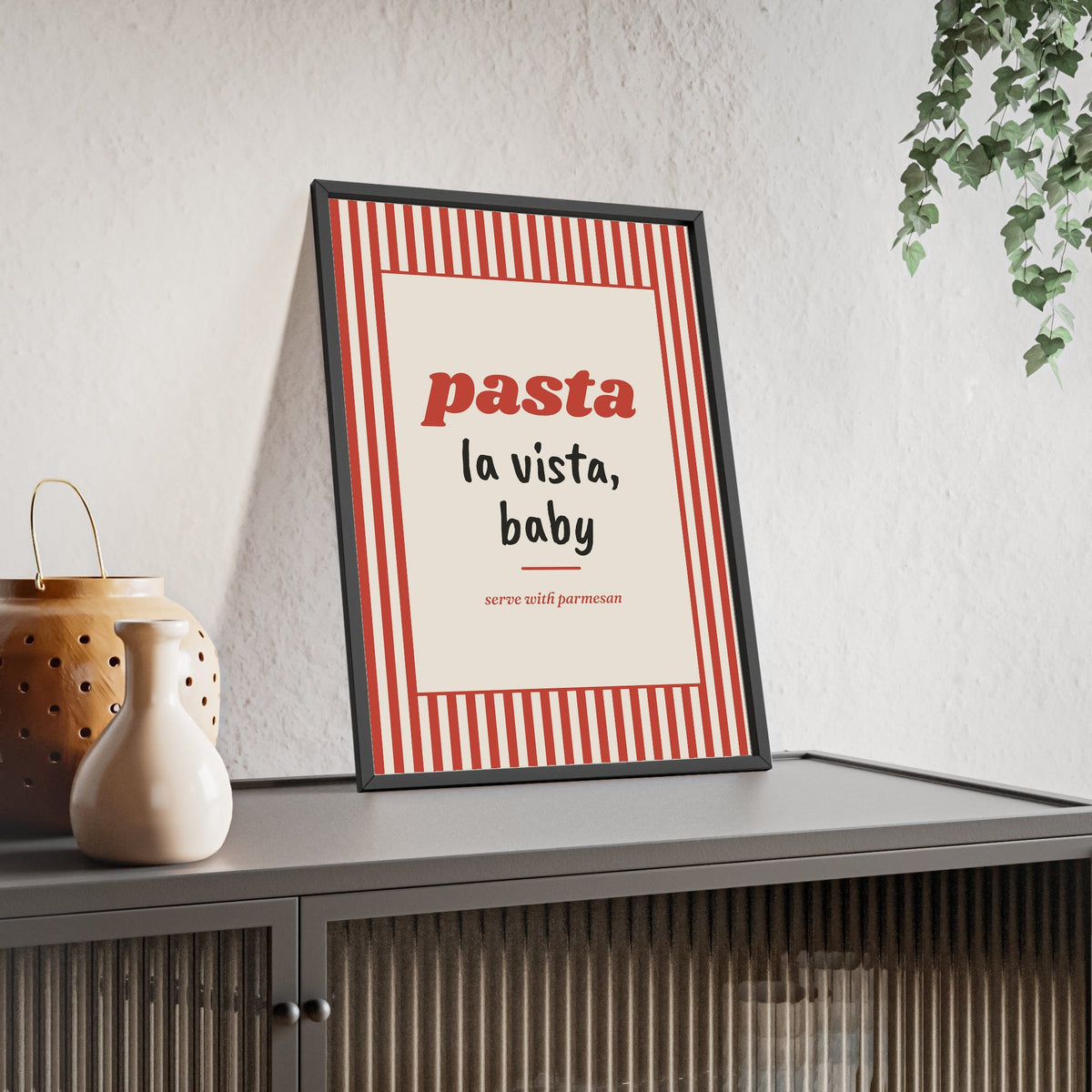 Pasta La Vista Print framed and leaning on a sideboard