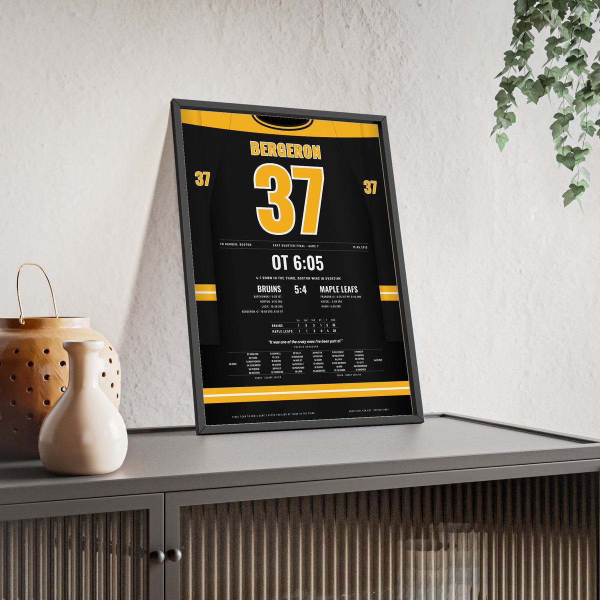 Patrice Bergeron 2013 Game 7 Overtime Winner Poster - Boston Bruins 37 Hockey Jersey Print framed and leaning on a sideboard