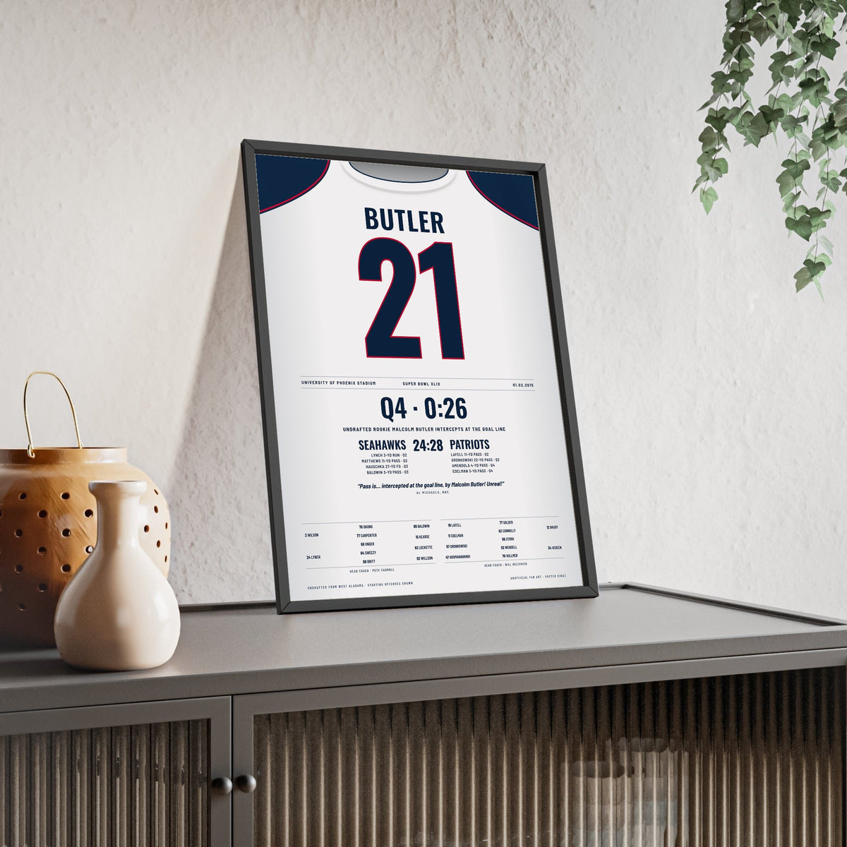 New England Patriots Super Bowl XLIX Poster - Malcolm Butler 21 Goal-Line Interception Jersey Print framed and leaning on a sideboard